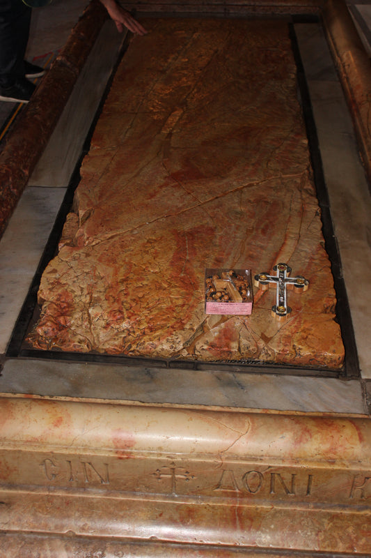 Stone of Anointing - gifts from ChristianCrafts.shop being blessed at Stone of Anointing