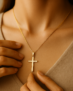 Person wearing a gold necklace with a cross pendant, with a free shipping badge in the corner.
