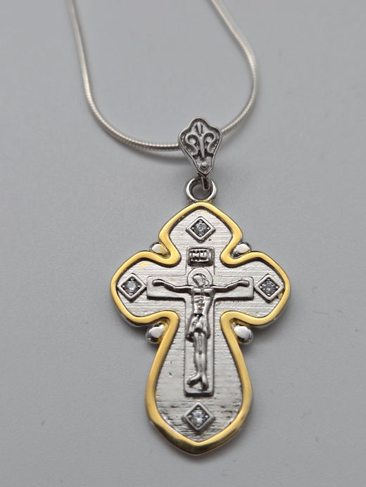 Silver and gold cross pendant inspired by the Magi’s gift of gold